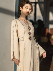 5206Beige Arabic Abaya Dress | V-Neck Gold Beaded Gown with Geometric Embroidery & Bell Sleeves